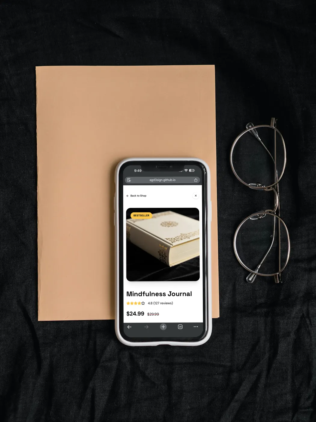 Safe Space shop page on a phone beside glasses